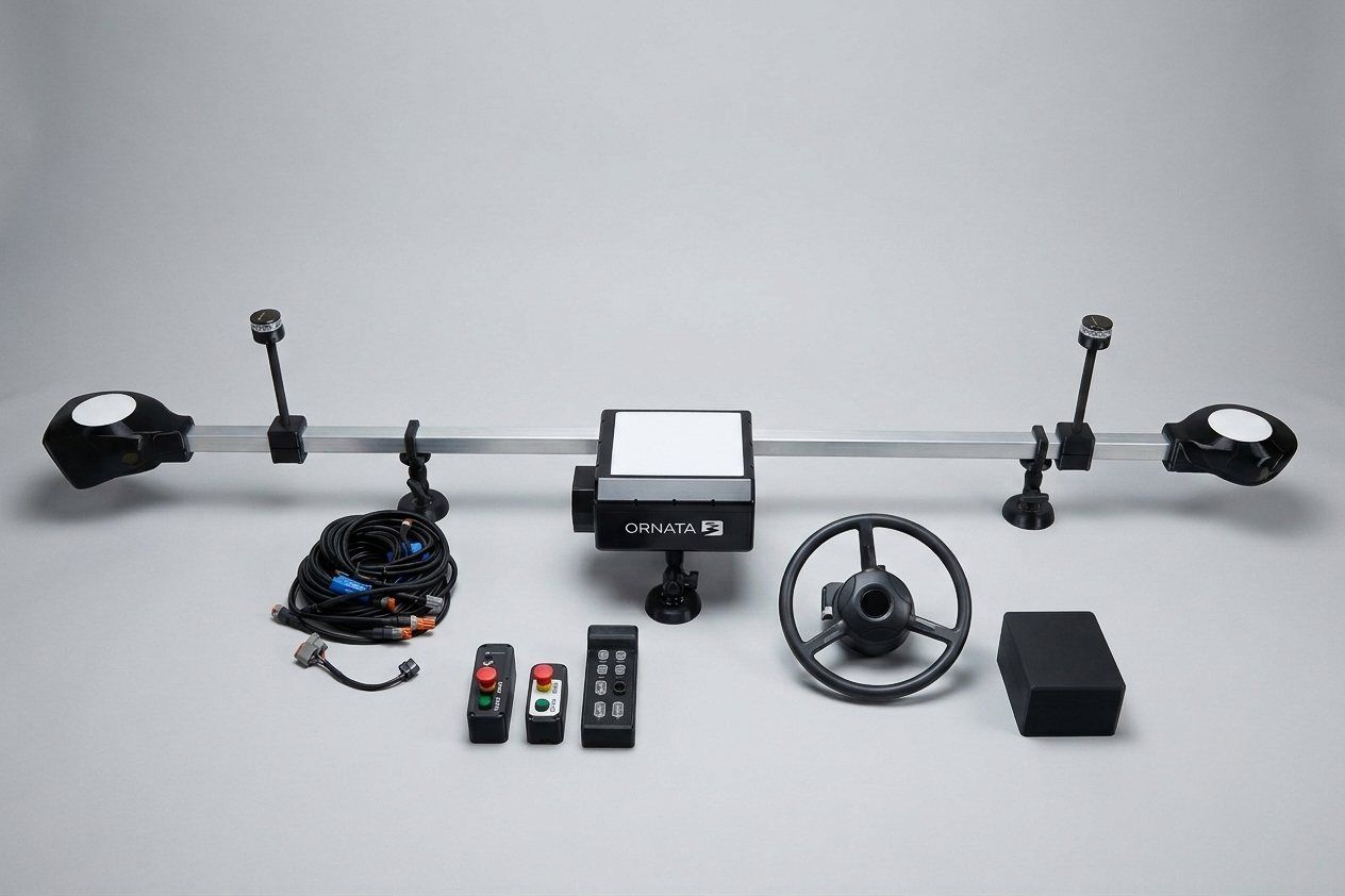 The Ornata retrofit kit laid out: sensor bar, control unit, steering unit, cabling and remote controls